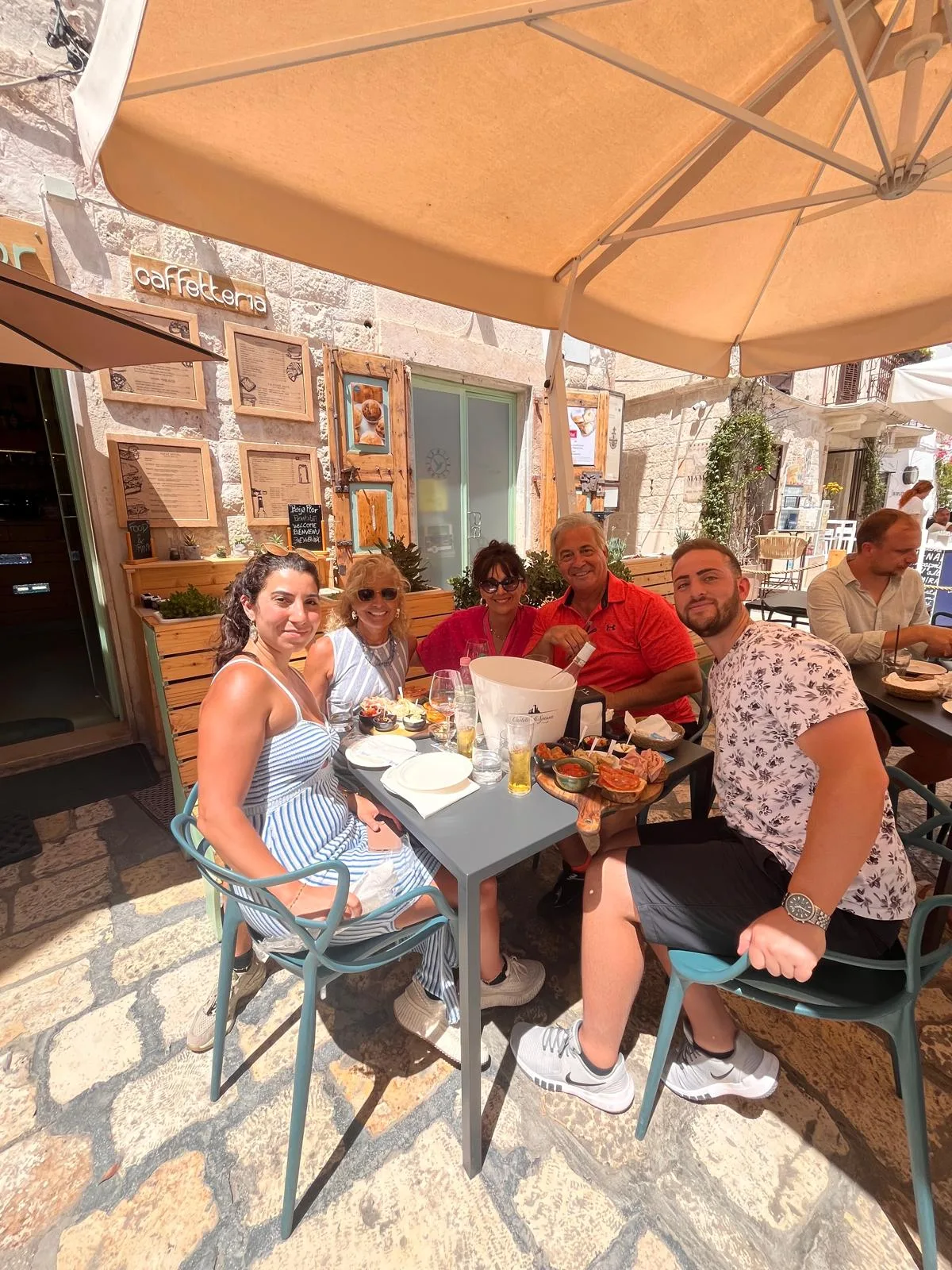 Margherita and her clients (a family) enjoying lunch together.