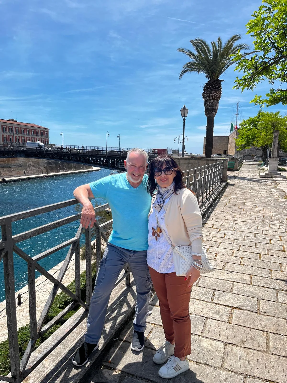 Margherita and her client with the Ponte Girevole behind them in Taranto
